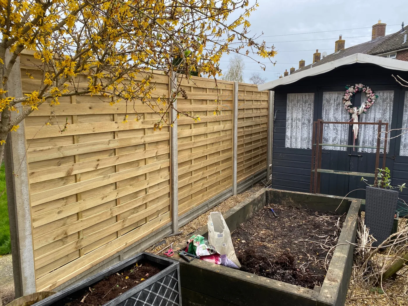 New timber fence line along a lawn